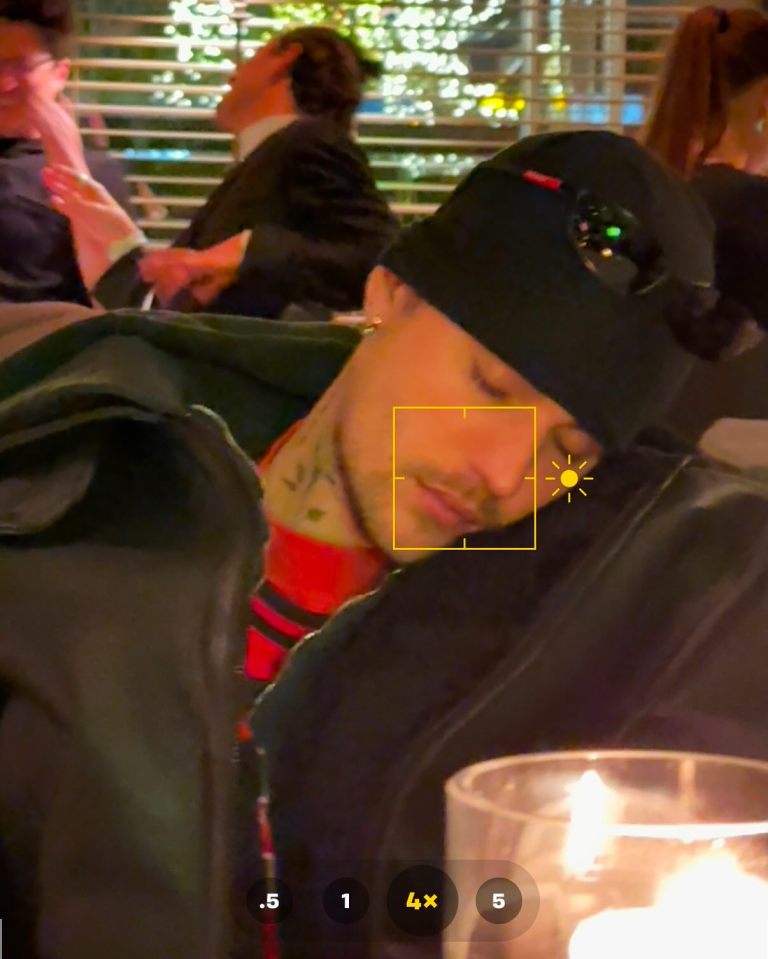 Justin Bieber asleep at a restaurant.