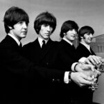 The Beatles show off their MBE medals after the royal investiture at Buckingham Palace, London, Tuesday 26th October 1965.