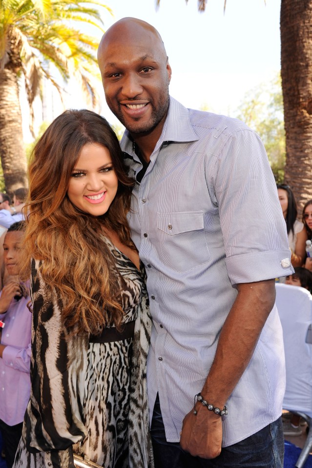 Lamar Odom and Khloe Kardashian at an event.