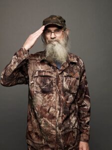 Si Robertson of Duck Dynasty saluting.