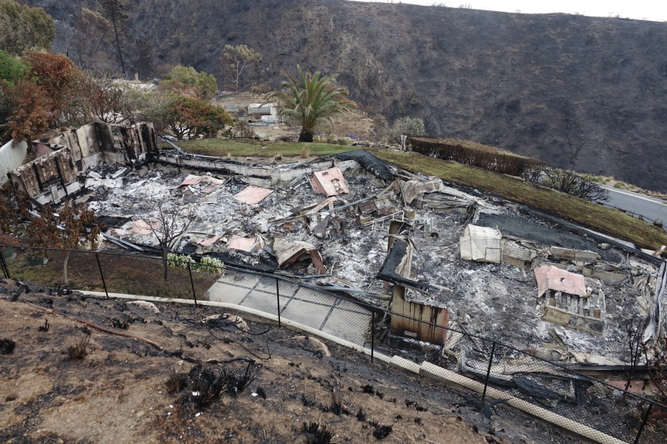 Fire-damaged remains of a house.