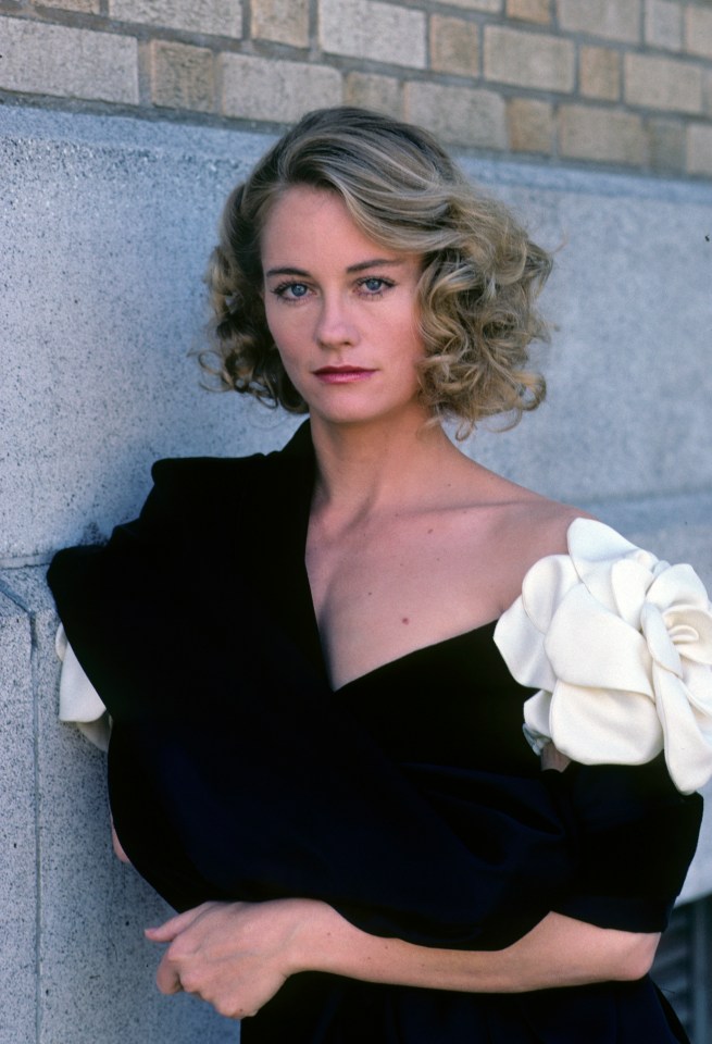 Cybill Shepherd in a black dress.