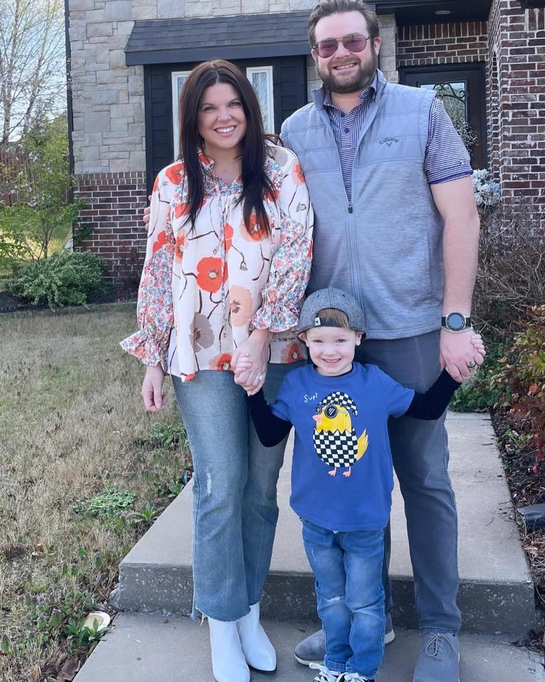 Family portrait in front of their house.