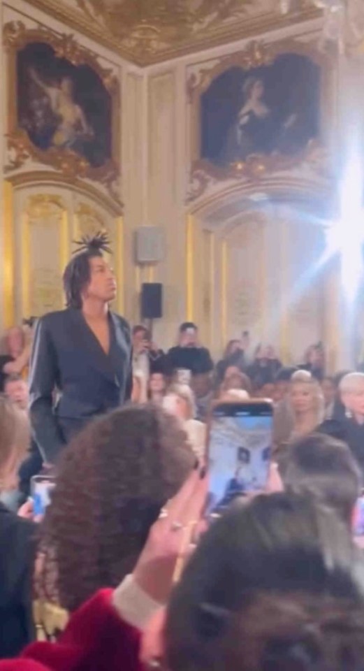 Henry Klum walking a runway at Paris Fashion Week.