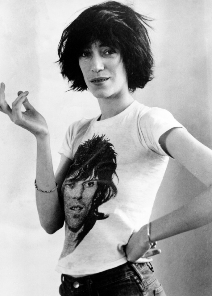 Black and white photo of Patti Smith wearing a t-shirt with a picture of Mick Jagger.