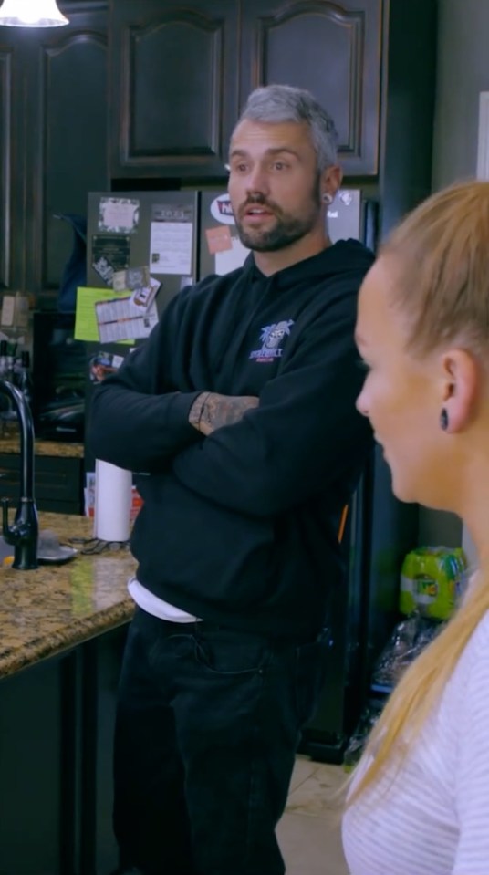 Ryan Edwards in a kitchen, speaking to a woman.