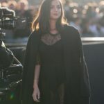 Ana de Armas wears a black coat, a black dress in transparent lace, outside Louis Vuitton