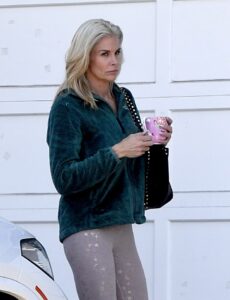 Brooke Burns holding a pink mug.