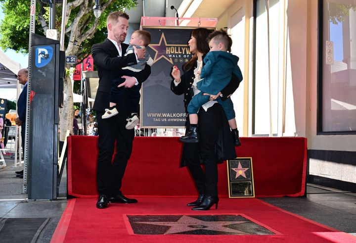 Macaulay Culkin, his partner Brenda Song and their children stand near his newly unveiled Hollywood Walk of Fame Star on December 1, 2023 in Hollywood.