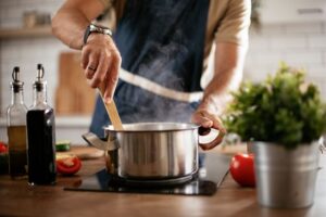 A man cooking a meal in the kitchen