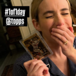 Emma Roberts holding a 1/1 Jackson Holliday card.