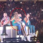 Miriam Cruz was caught snogging singer Romeo Santos on stage in the Dominican Republic