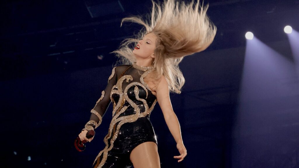 Taylor Swift flipping her hair at the Eras Tour