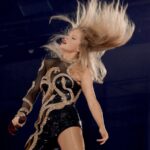 Taylor Swift flipping her hair at the Eras Tour