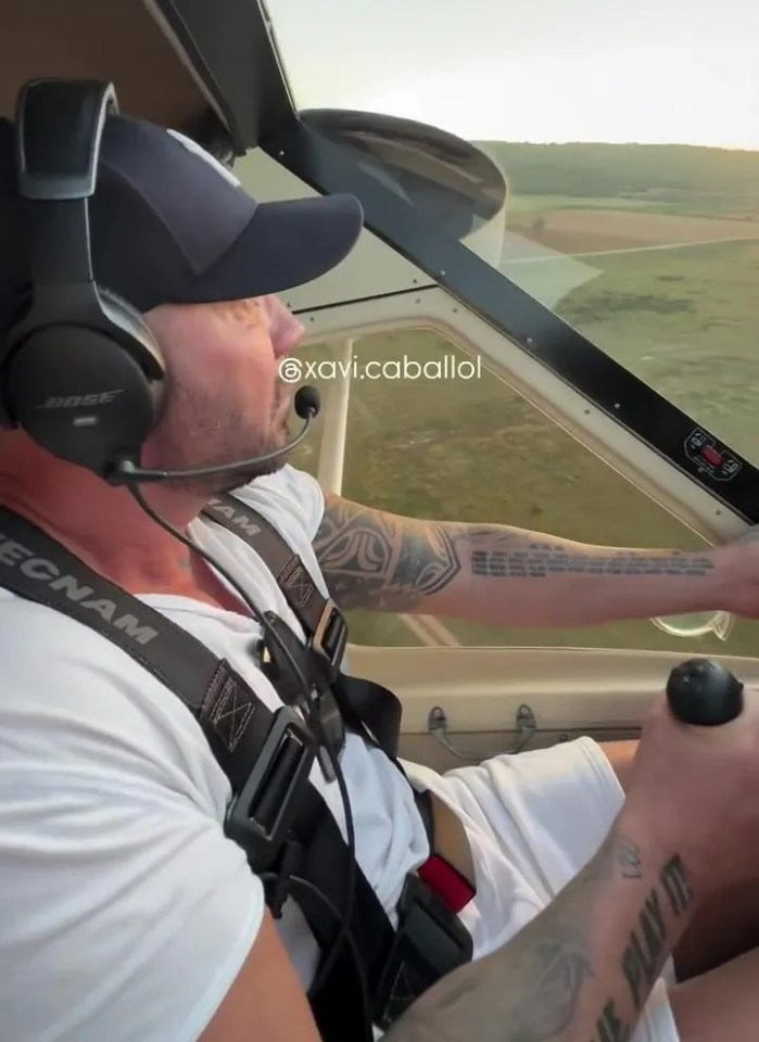 Man piloting an ultralight aircraft.