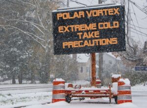 A sign warning about a polar vortex in the snow