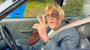 jay leno facial injuries peace sign