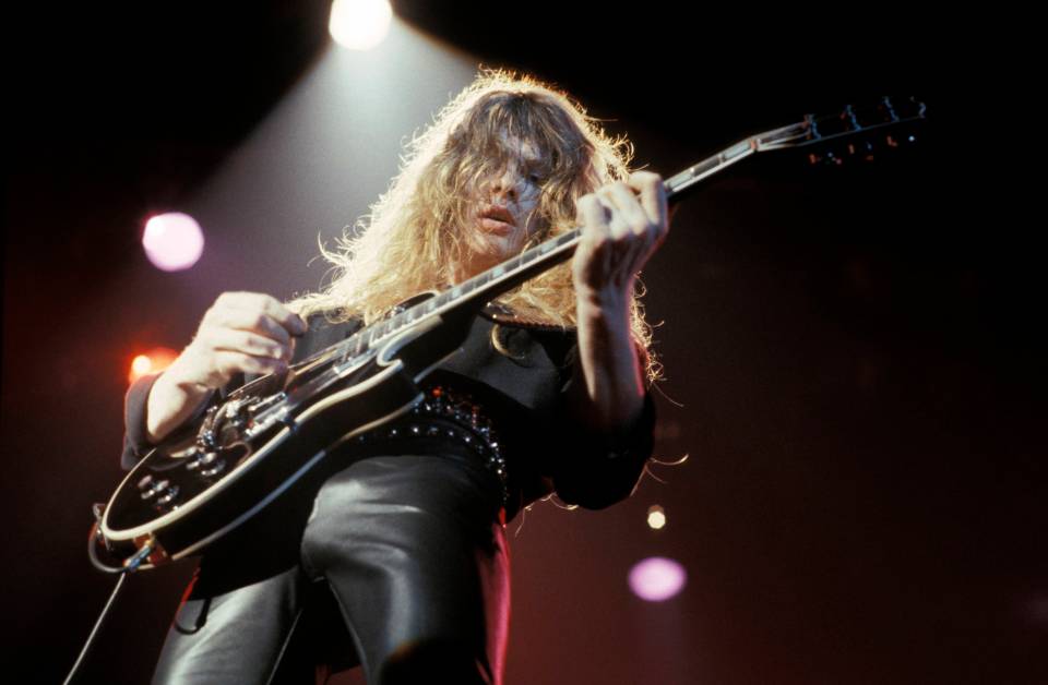 John Sykes of Thin Lizzy performing live onstage.