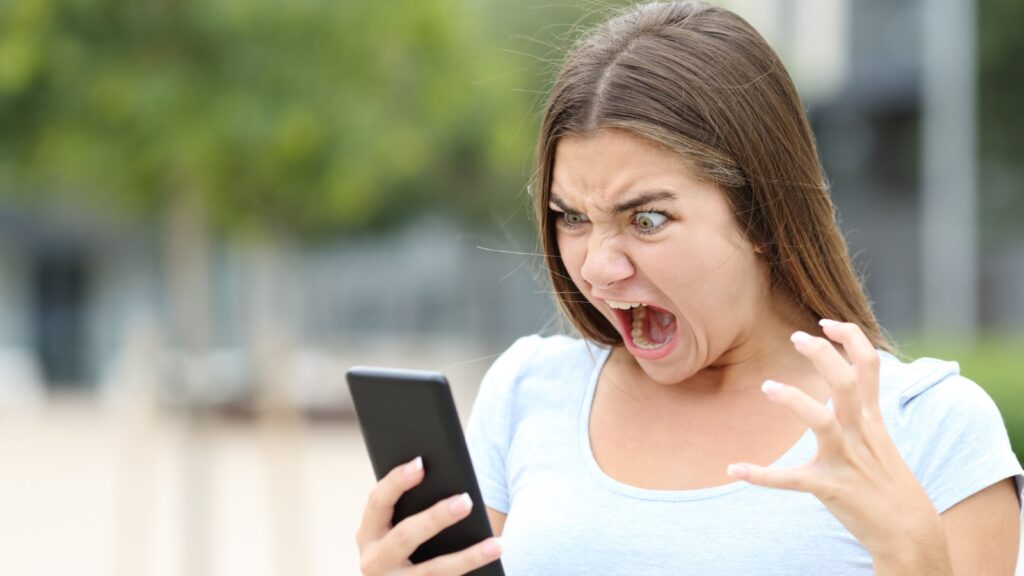 angry woman raging at social media post