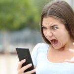 angry woman raging at social media post