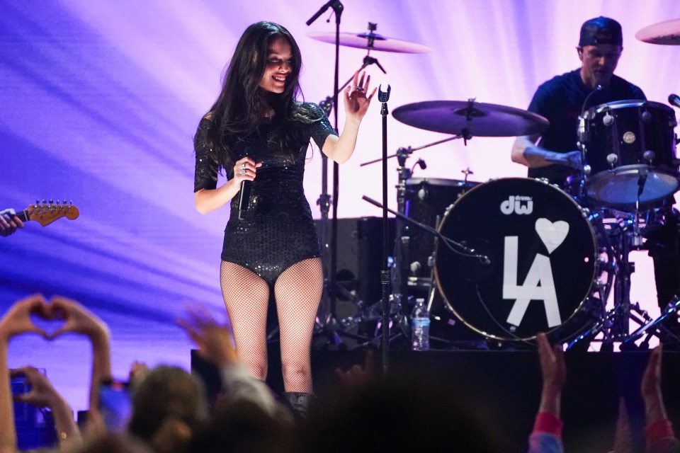 Olivia Rodrigo performing at a FireAid benefit concert.