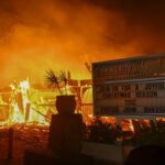 The Pacific Palisades fire (depicted) has become the most destructive in Los Angeles history.