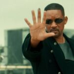 Will Smith holding up his hand.