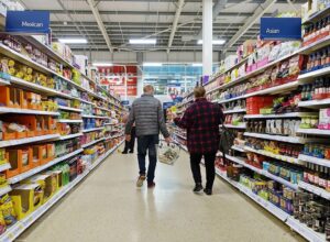 Customers browsing the grocery aisles at Walmart