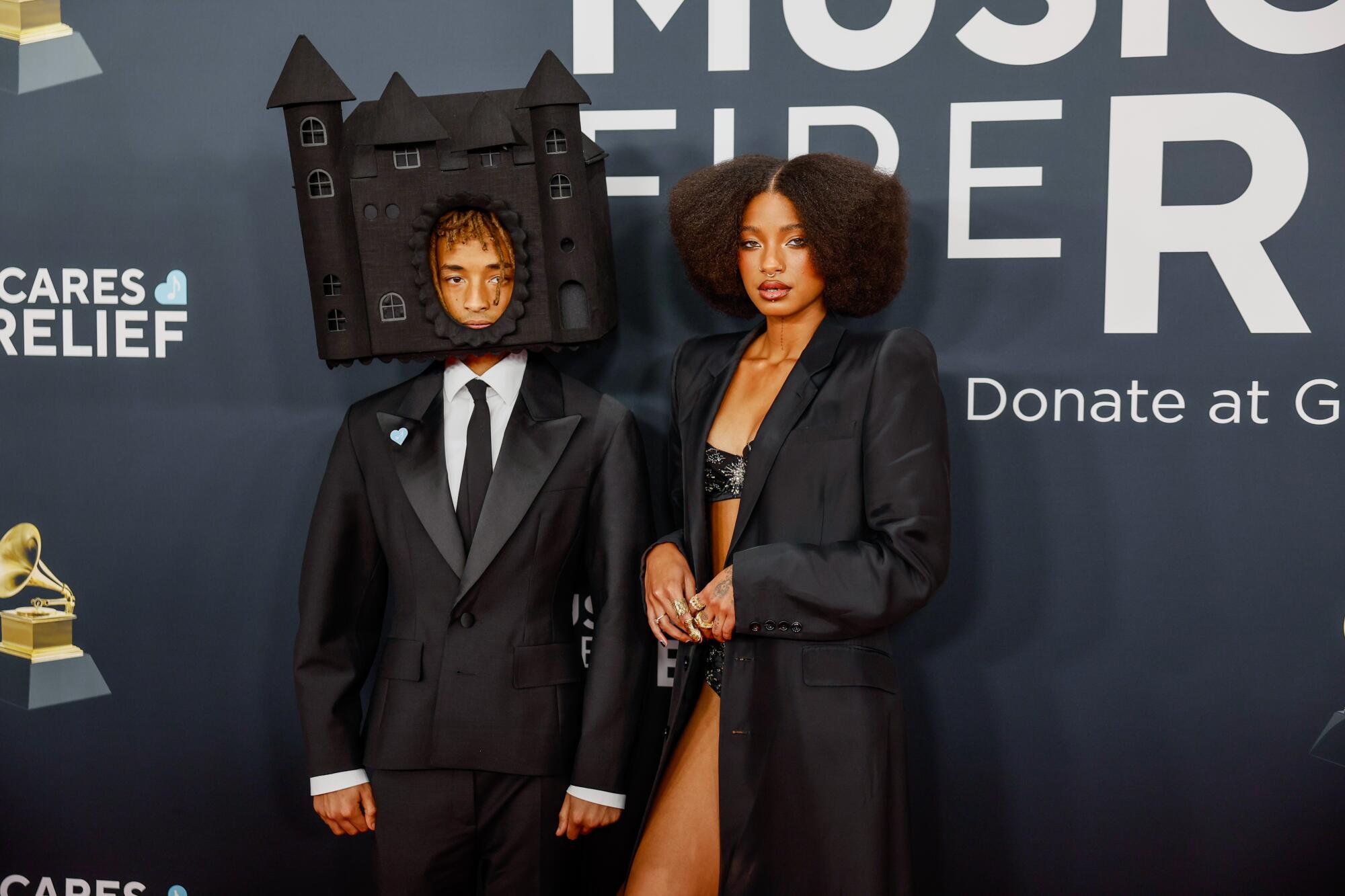 Jaden Smith, with house on head, is accompanied by sister Willow Smith at the Grammys