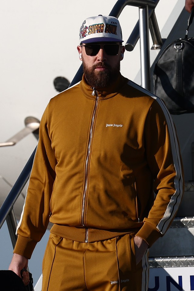 Travis Kelce of the Kansas City Chiefs arriving at an airport.