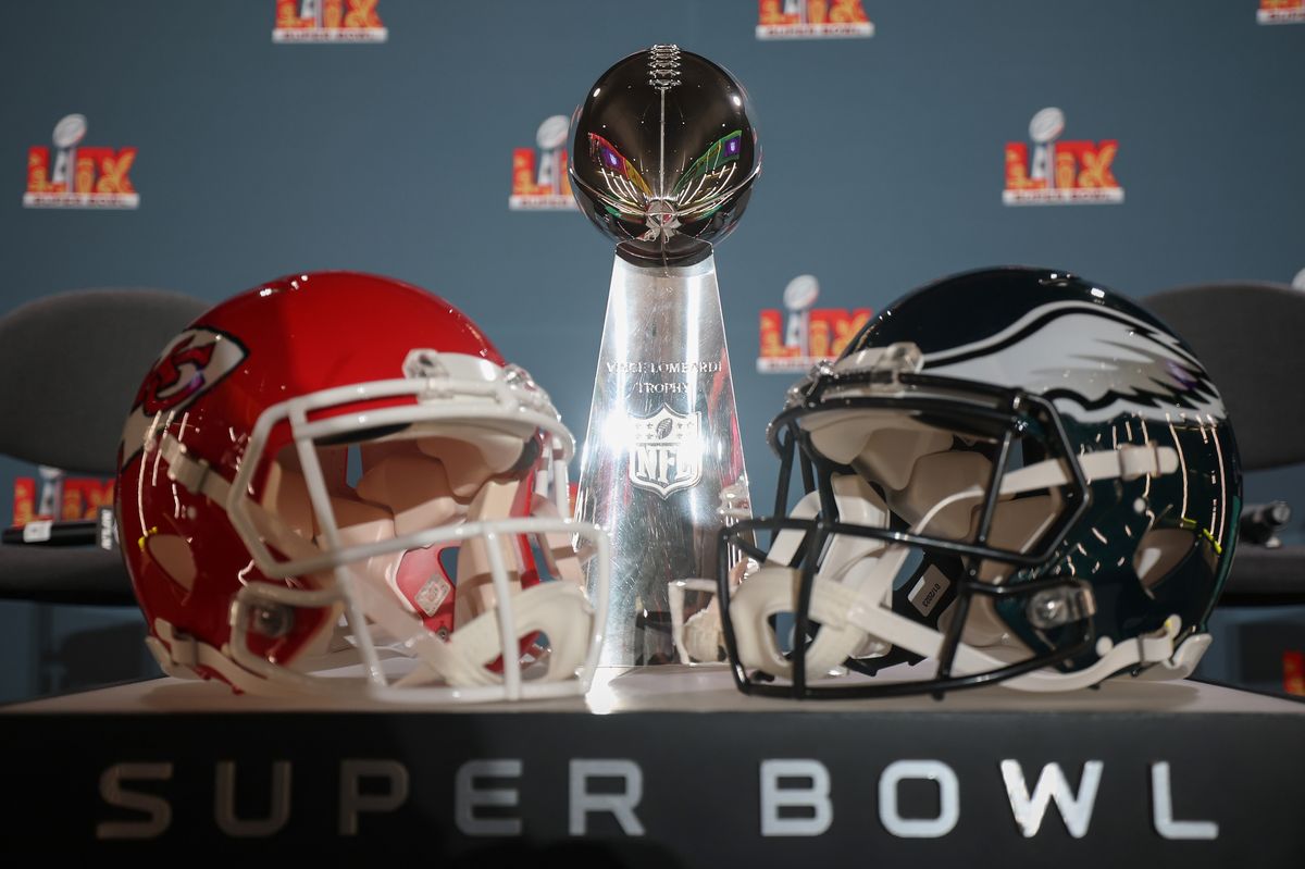 NEW ORLEANS, LOUISIANA - FEBRUARY 03: A Kansas City Chiefs helmet, the Vince Lombardi Trophy and a Philadelphia Eagles helmet are seen before the NFL Commissioner Roger Goodell's Super Bowl Press Conference ahead of Super Bowl LIX at Caesars Superdome on February 03, 2025 in New Orleans, Louisiana. (Photo by Chris Graythen/Getty Images) 