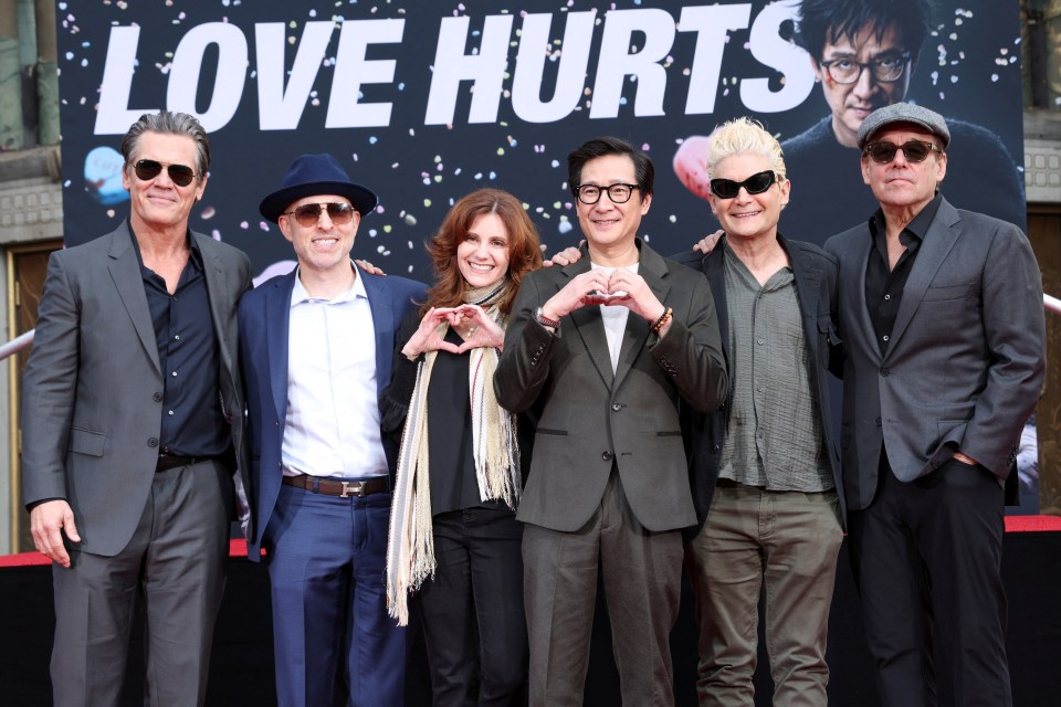 The cast of "Love Hurts" at a ceremony.