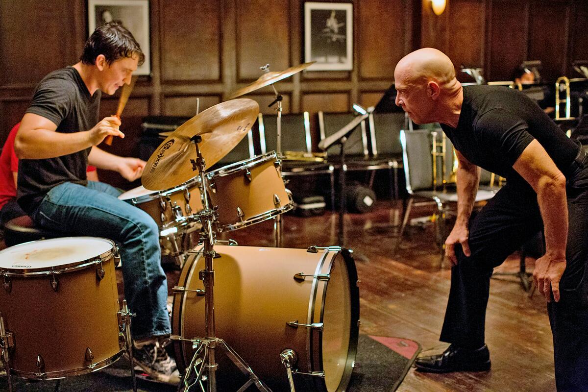 Miles Teller as Andrew, left, and J.K. Simmons as Fletcher in a scene from "Whiplash" 