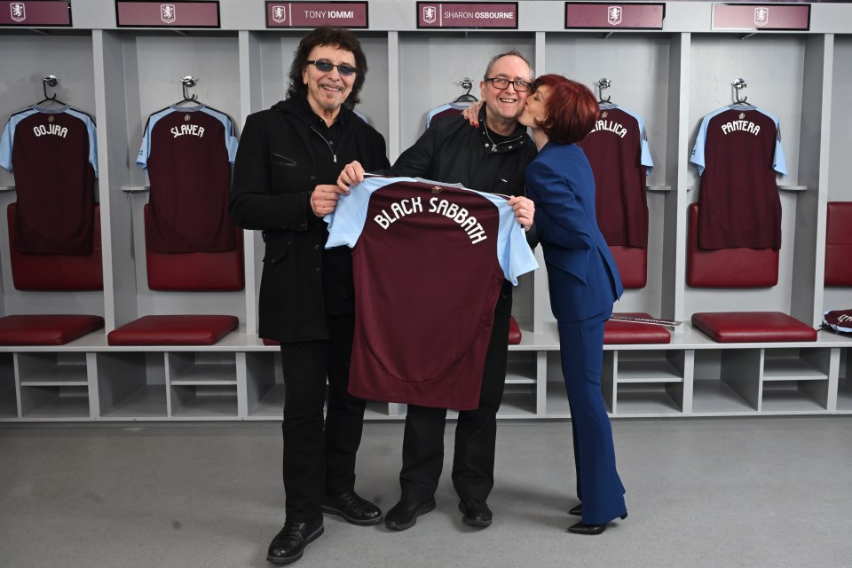 Tony Iommi, Andy Copping, and Sharon Osbourne holding a Black Sabbath jersey.