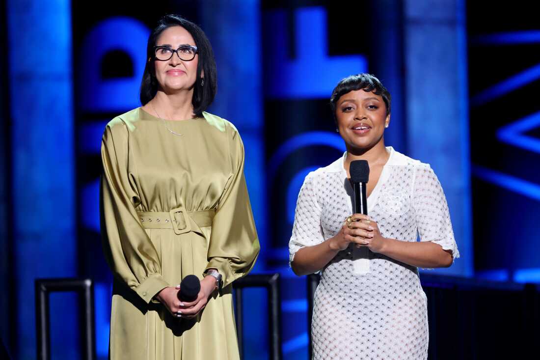 Aurora Barboza Flores and Quinta Brunson speak onstage during the FireAid benefit concert for California fire relief in Inglewood, California.