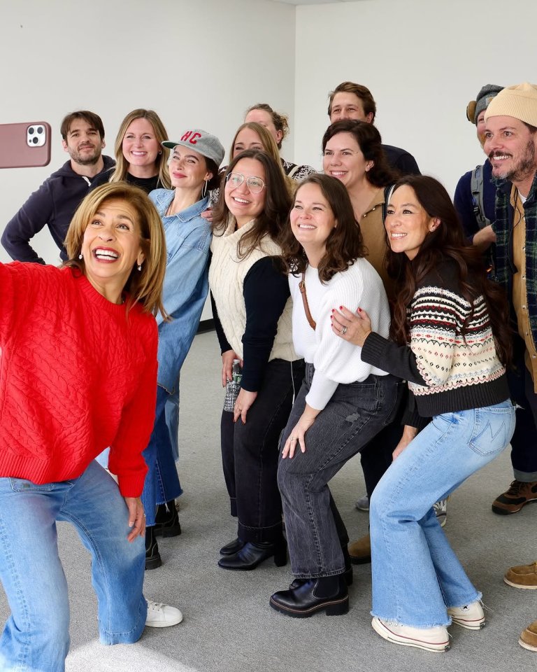 Hoda Kotb taking a selfie with a group of people.