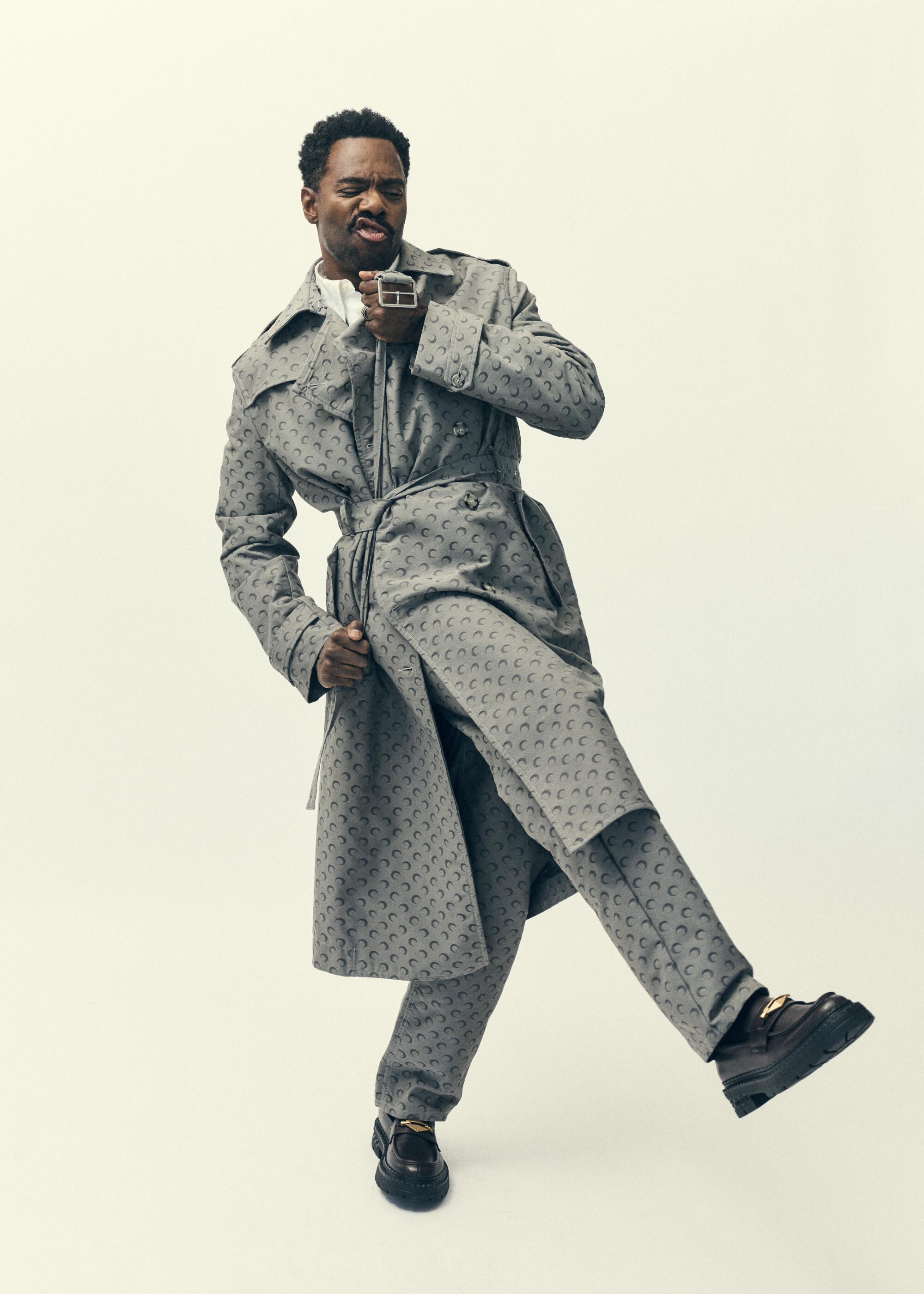 Colman Domingo, star of "Sing Sing" kicks a leg forward in a jaunty pose.