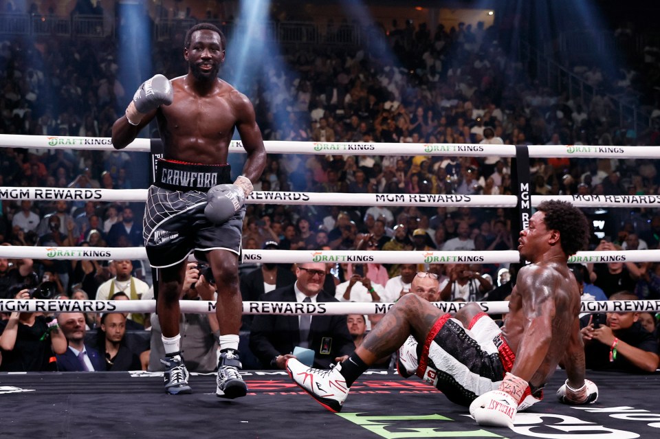 Terence Crawford celebrates his victory over Errol Spence Jr. in a welterweight championship boxing match.