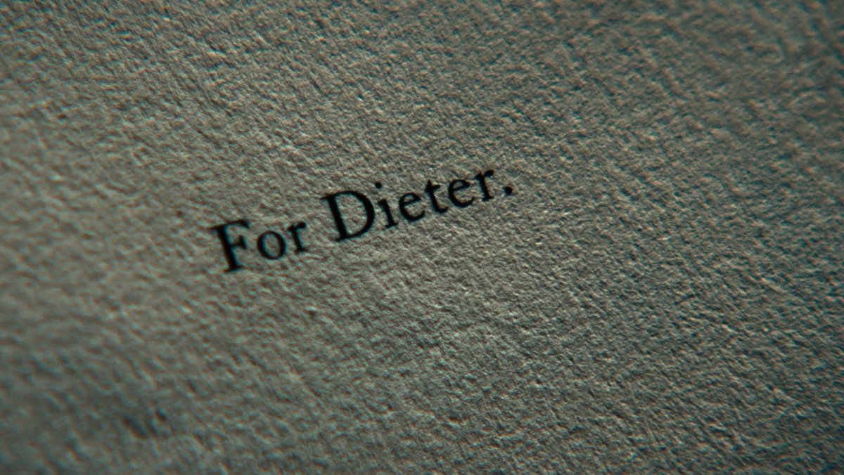 A page with typewriter text saying For Dieter. on Severance