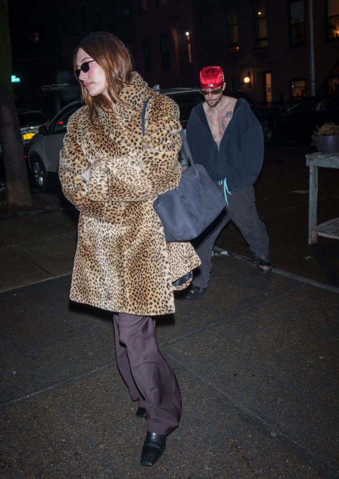 Hailey and Justin Bieber walking at night in New York City.