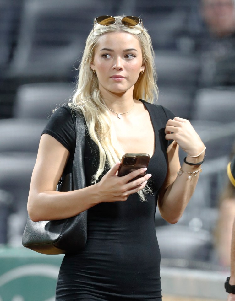 LSU gymnast Olivia Dunne looking at her phone.