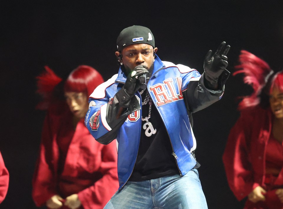 Kendrick Lamar performing at a Super Bowl halftime show.