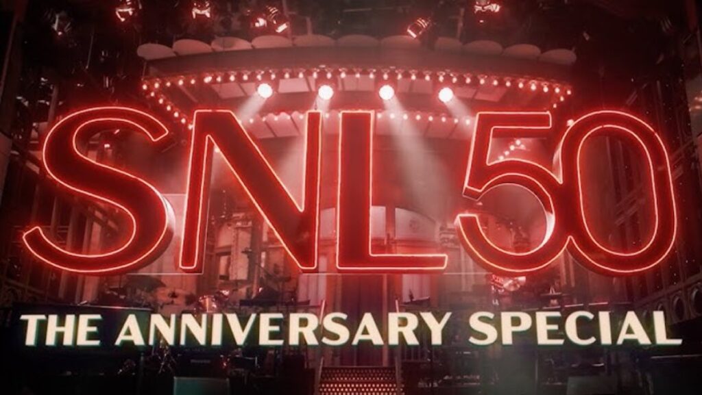 Text SNL 50 The Anniversary Special in front of red lit theater marquee.