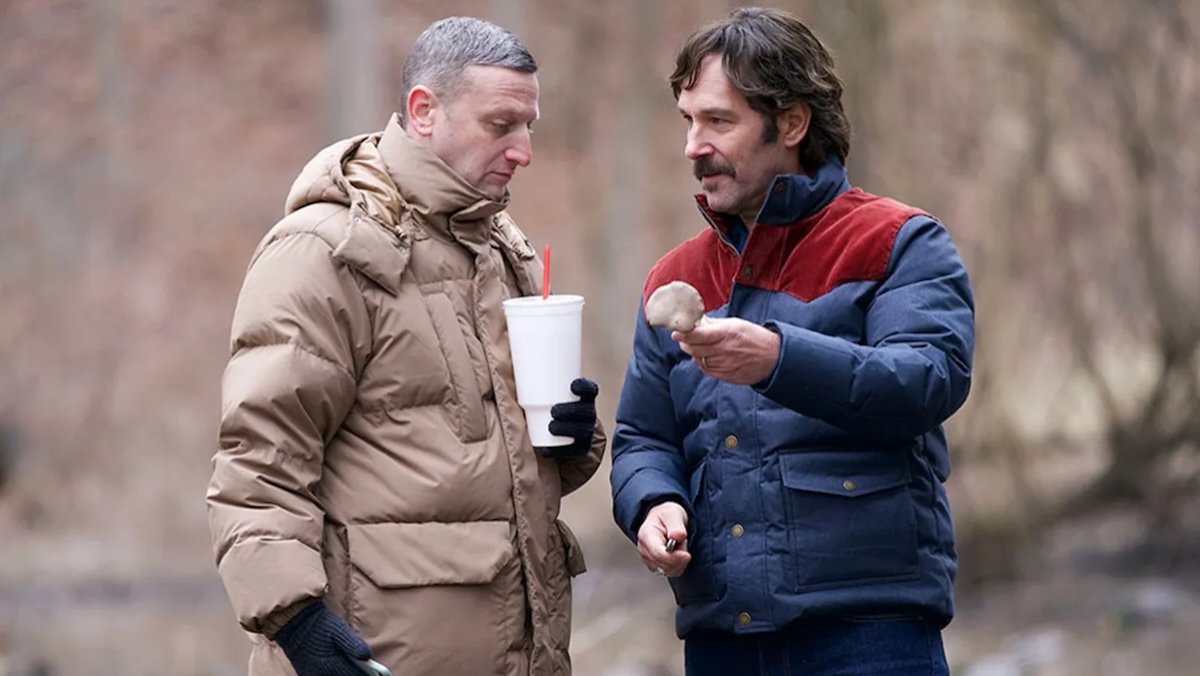 Tim Robinson and Paul Rudd in winter coats talking outside in Friendship