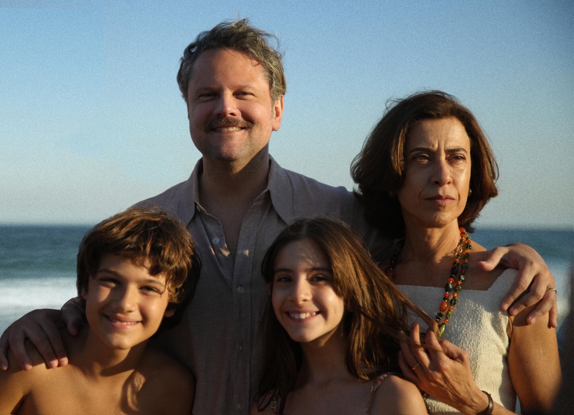 The Paiva family pose for a portrait on the beach in a scene from "I'm Still Here."