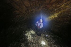 A London city worker clears up a fatberg in 2014. A fatberg in Australia caused the cancellation of a concert over the potential for wastewater overflow.