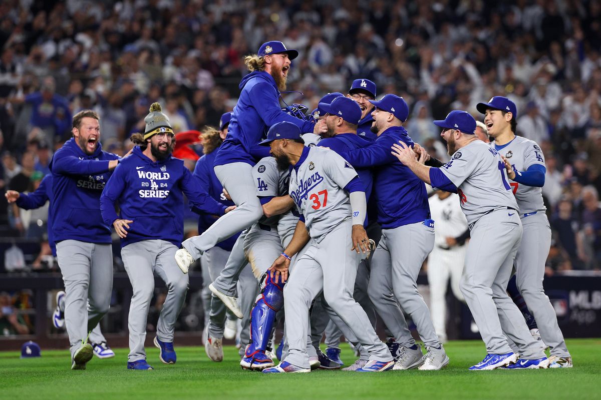 The Los Angeles Dodgers celebrate as they defeat the New York Yankees 