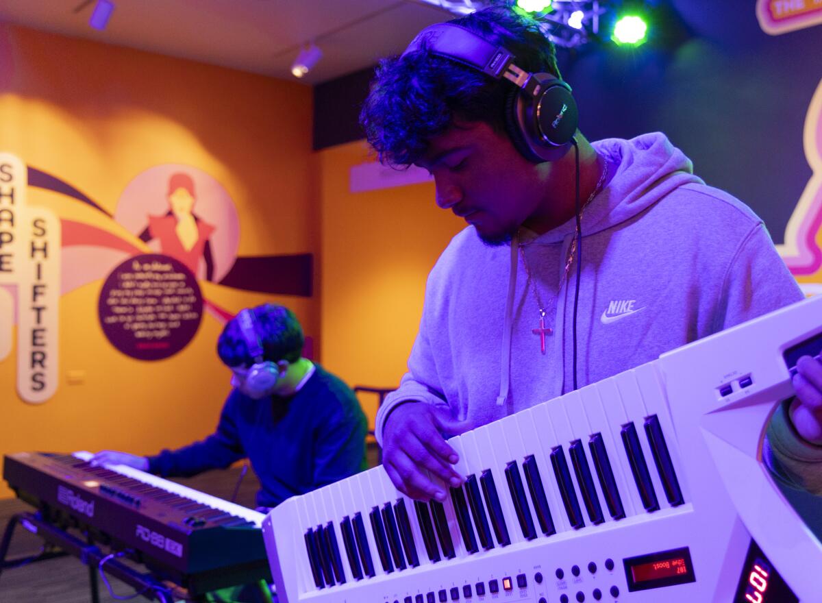 STEAM Legacy High School students Alexis Medrano, left, and Christopher Luna play keyboards in the Sonic Playground.