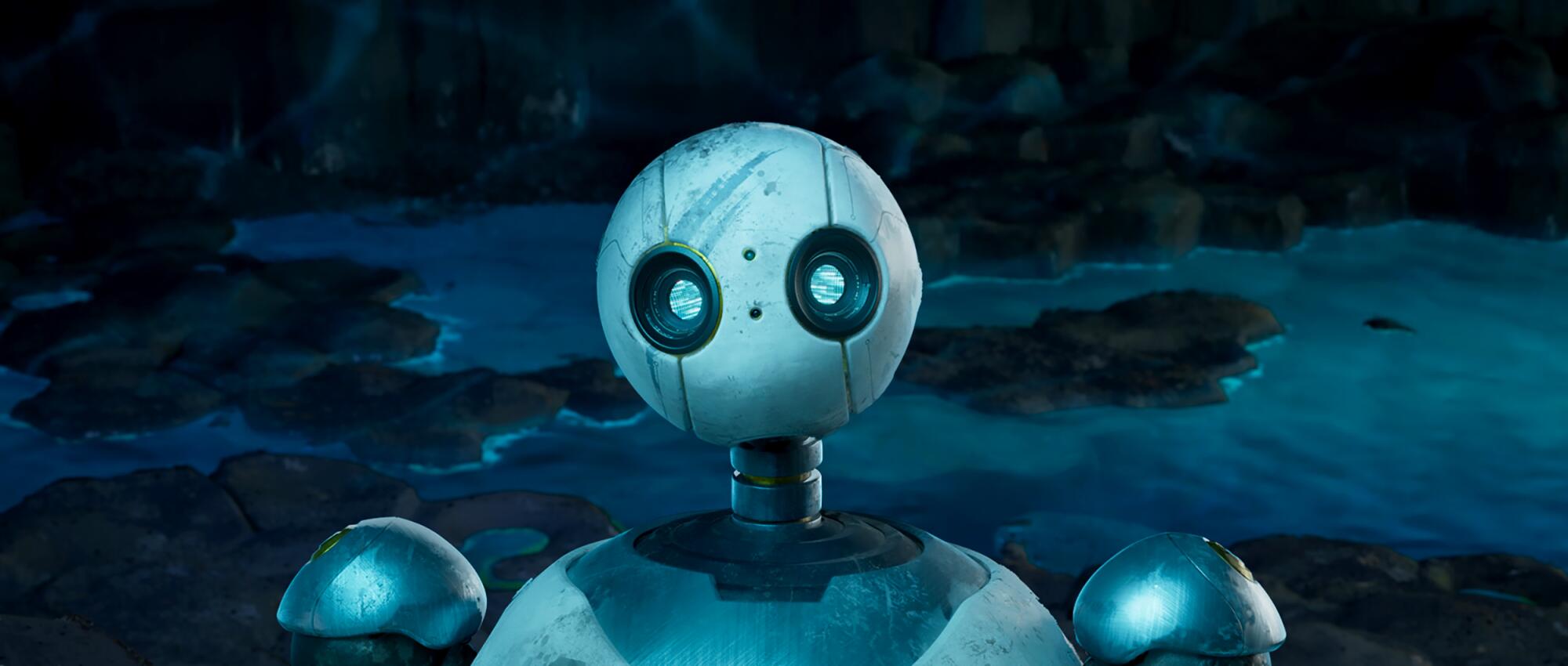 A robot's round head has large, glassy eyes but no nose or mouth.