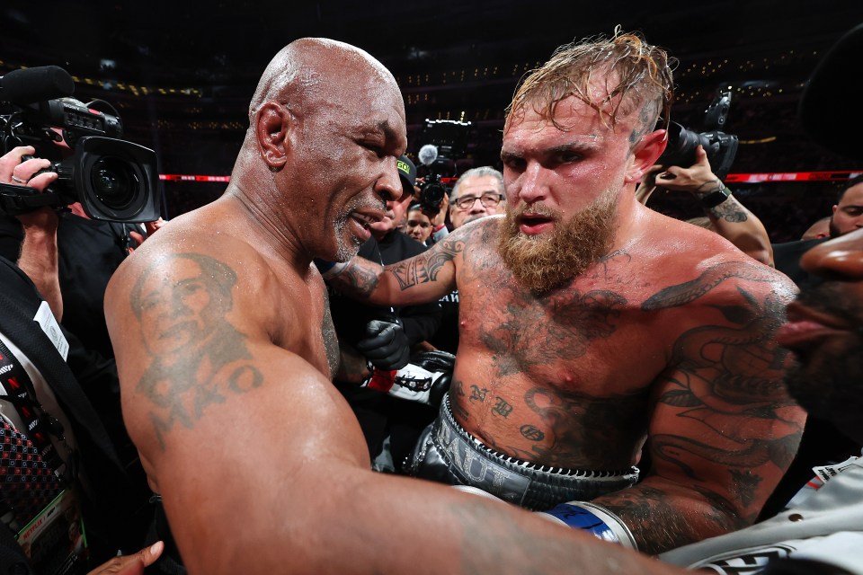 Jake Paul and Mike Tyson after a boxing match.